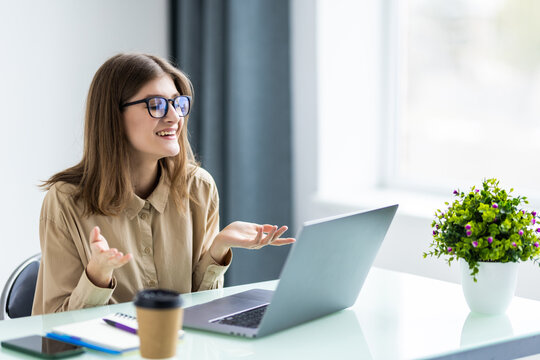 Young Business Woman Having Video Call Via Laptop In The Office