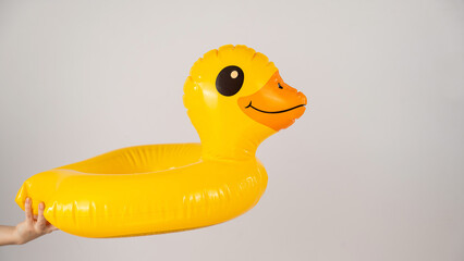 Children's inflatable circle duck on a white background. 