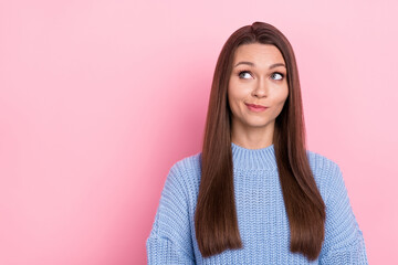 Photo of unsure millennial brown hairdo lady look promo wear blue pullover isolated on pink color...