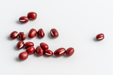 Close-up of red beans on white background