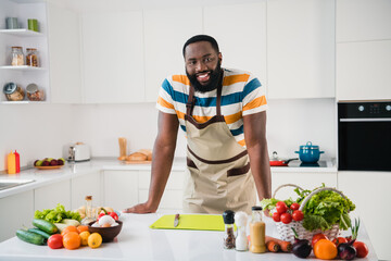 Photo of positive cheerful young person toothy smile look camera kitchen room indoors