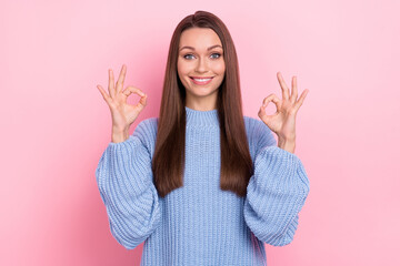 Photo of funky millennial brown hairdo lady show okey wear blue pullover isolated on pink color background