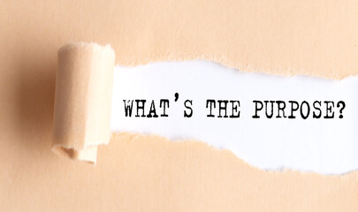 The text WHAT'S THE PURPOSE appears on torn paper on white background.