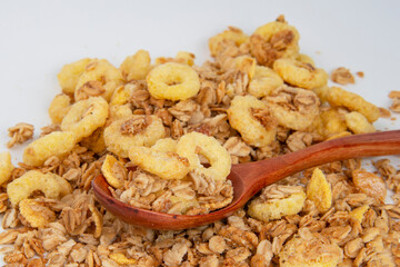 Oatmeal cereal breakfast in wooden spoon textured background