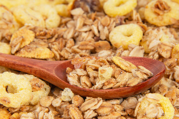 Oatmeal cereal breakfast in wooden spoon textured background