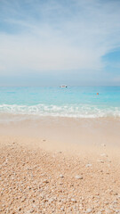 sea beach with white rocks and blue water