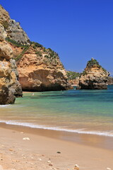 Sea stack and cliffs-northernmost end Praia do Camilo Beach. Lagos-Portugal-260