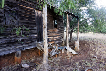 Abandoned old workers cottage in outback Queensland made of weatherboard or clapboard. © Inge