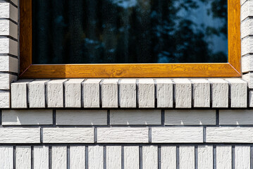 Background made of the facade of the building made white brick, a large fugue between the bricks...