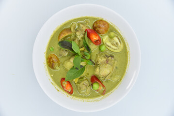 Green Curry with Chicken - Thai food, top view on white background.