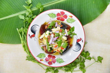 Spicy Century Egg Salad - Thai food, top view on white background.