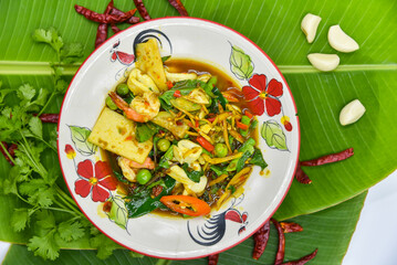 Stir-fried Spicy Seafood with Fingerroot - Thai food, top view on white background.