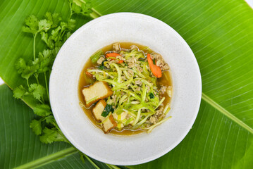 Stir-fried White Garlic Chives with Egg Bean Curd and Minced Pork - Thai food, top view on white background.