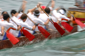 group of people in a boat shown in artistic blur of motion