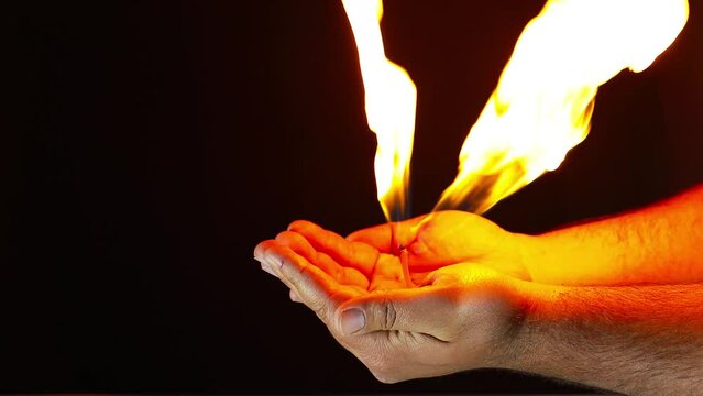 reality fire and hand on a black  background