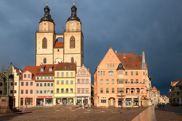 View on the market square with town hall and Stadtkirche Wittenberg in Lutherstadt Wittenberg city, Saxeny-Anhalt. Wittenberg, Germany - 506823475