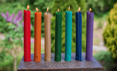 Chakras colorful handmade candles from wax. Energy therapy, mental healing