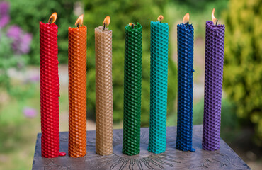 Chakras colorful handmade candles from wax. Energy therapy, mental healing
