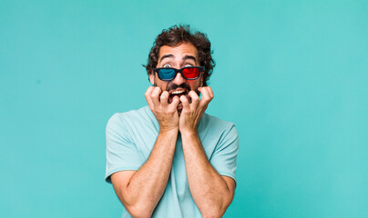young adult hispanic crazy man with 3d cinema glasses - obrazy, fototapety, plakaty