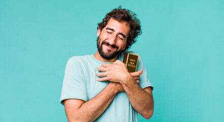 young adult hispanic crazy man holding a gold ingot