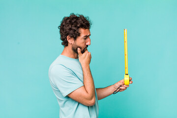 young adult hispanic crazy man with a medition meter