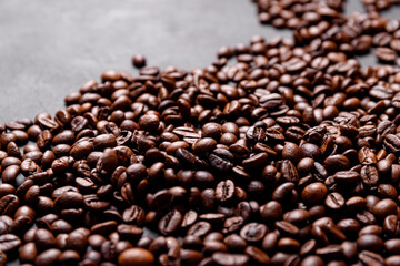 Hot fresh black coffee with milk foam for morning menu in white ceramic cup with coffee beans roasted on.