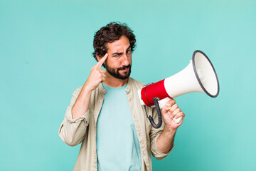 young adult hispanic crazy man with a megaphone