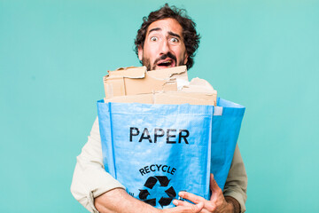 young adult hispanic crazy man. recycling an ecology concept