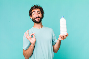 young adult hispanic crazy man with a milk bottle