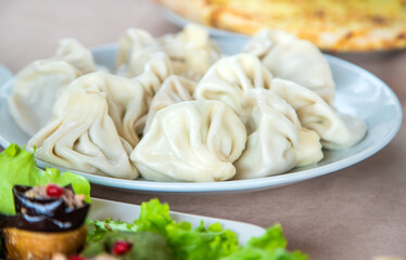 Georgian cuisine khinkali on the table. Selective focus.