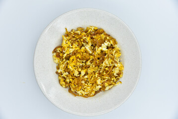 Stir-fried Preserved Radish with Egg - Thai food, top view on white background.