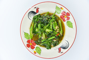 Stir-fried Kale with Oyster Sauce - Thai food, top view on white background.