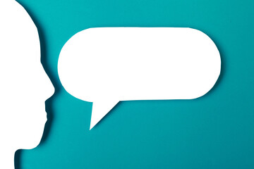  paper face and speech bubble on colorbackground copy space for text, communication, symbolic- Image