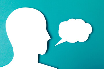  paper face and speech bubble on colorbackground copy space for text, communication, symbolic- Image