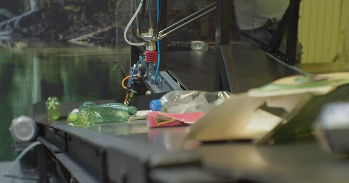 modern industrial processing of household waste.plastic bottles and paper packaging move along a sorting line conveyor at a recycling plant.close-up.