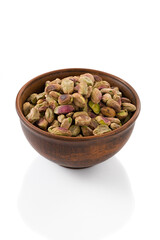 peeled pistachio in a cup on a white background isolated with clipping path