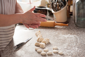 the process of cutting the dough into smaller pieces for cooking