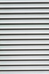 Obraz premium Grey metal surface of the ventilation grid