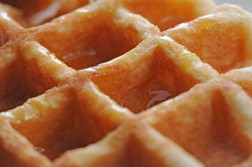 Closeup of waffle with syrup