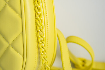 Fragment accessories of an yellow quilted bag