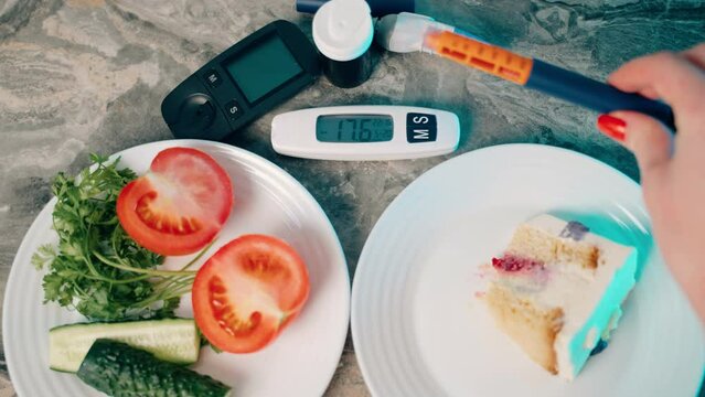 Diabetic devices. Piece of cake and fresh vegetables. Dilemma of choosing between healthy food and sweets. High sugar. Hyperglycemia. Girl takes syringe pen with insulin for subcutaneous injection