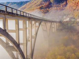 Obraz premium Montenegro. Dzhurdzhevich Bridge Over The River Tara foggy morning