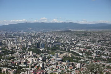 Fotobehang View from the observation deck on the mountain to the city of Tbilisi in Georgia © malazoniia