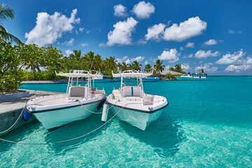 Tropical beach in Maldives. Travel and tourism to luxury resorts in the Maldives islands. Summer holiday concept