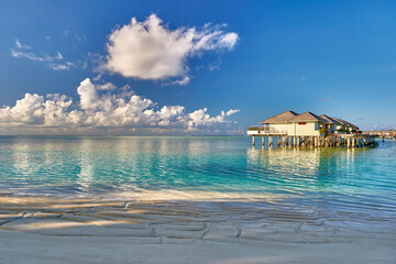 Tropical beach in Maldives. Travel and tourism to luxury resorts in the Maldives islands. Summer holiday concept