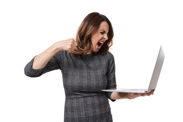 Frustrated furious businesswoman with her laptop on white background