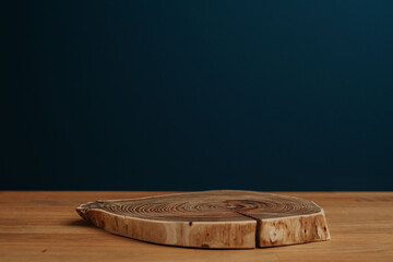 Wooden natural desk and dark blue background with copy space;