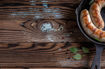 Sausages in a pan. Top view with copy space