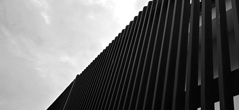 Fine art of sky and aluminium-iron fence with black and white saturation.