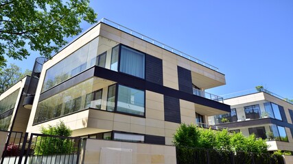 Apartment residential house and home facade architecture and outdoor facilities. Blue sky on the background. Sunlight in sunrise.
